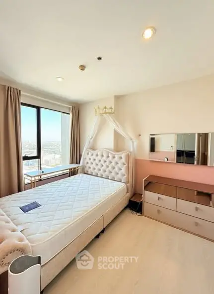 Bright bedroom with city view and elegant furnishings