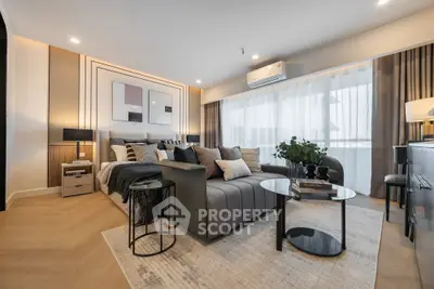 Luxurious modern living room with stylish decor and large windows.