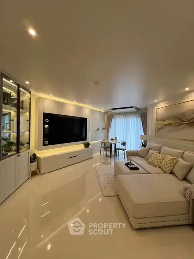Luxurious modern living room with elegant decor and spacious seating area, perfect for relaxation and entertainment.