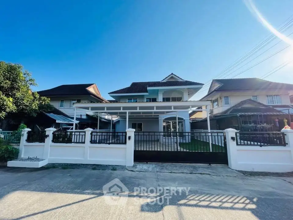 Stunning two-story house with modern design and spacious driveway in a serene neighborhood.