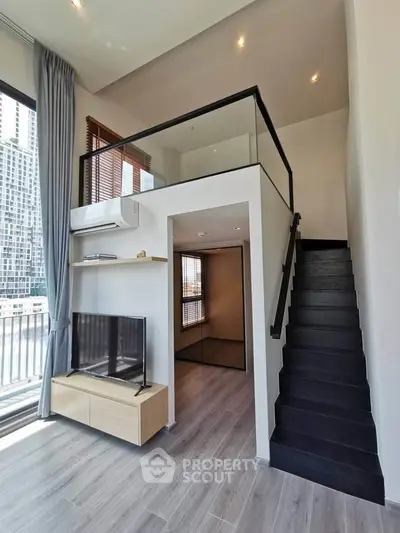 Modern loft apartment with mezzanine and sleek staircase