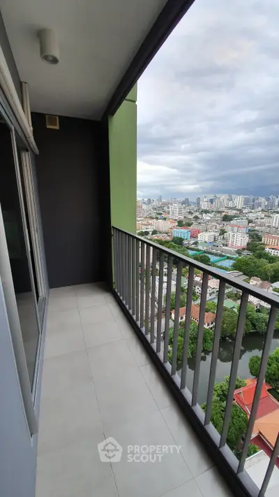 Spacious balcony with stunning city view in modern high-rise apartment