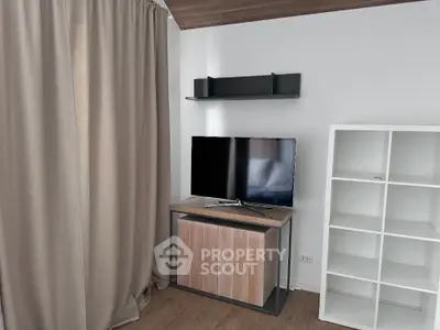 Modern living room with sleek TV stand and stylish shelving unit