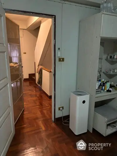 Cozy interior with wooden flooring and modern air purifier in hallway