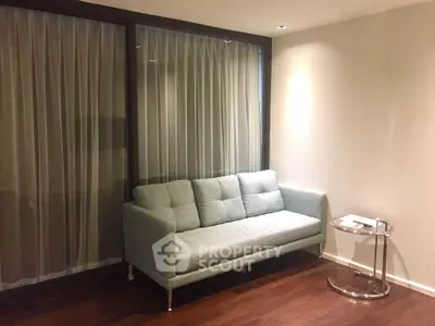 Modern living room with elegant sofa and sleek side table, perfect for urban lifestyle.