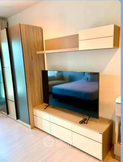 Modern living room with sleek TV unit and stylish storage cabinets