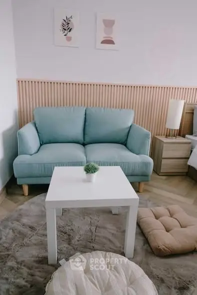 Charming living room with cozy blue sofa and modern decor