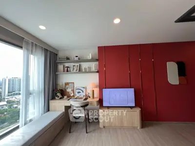 Modern living room with stylish decor and large window view