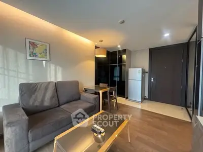 Modern living room with cozy sofa and dining area in stylish apartment.