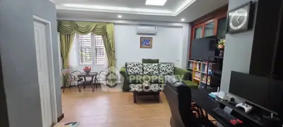 Spacious living room with elegant decor and modern entertainment setup