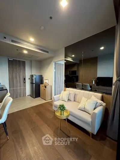Modern living room with stylish decor and open kitchen layout