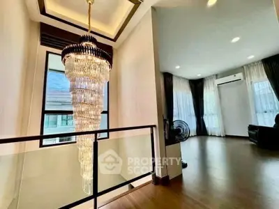 Luxurious interior with stunning chandelier and spacious living area, perfect for modern living.