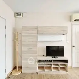 Modern living room with stylish wooden entertainment unit and flat-screen TV