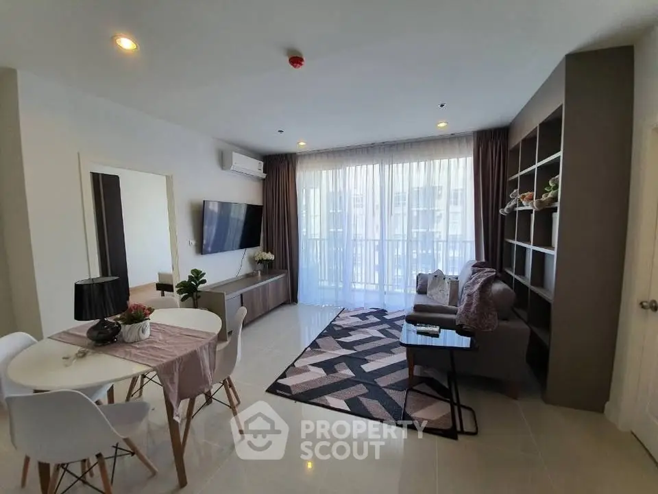 Modern living room with stylish decor and ample natural light