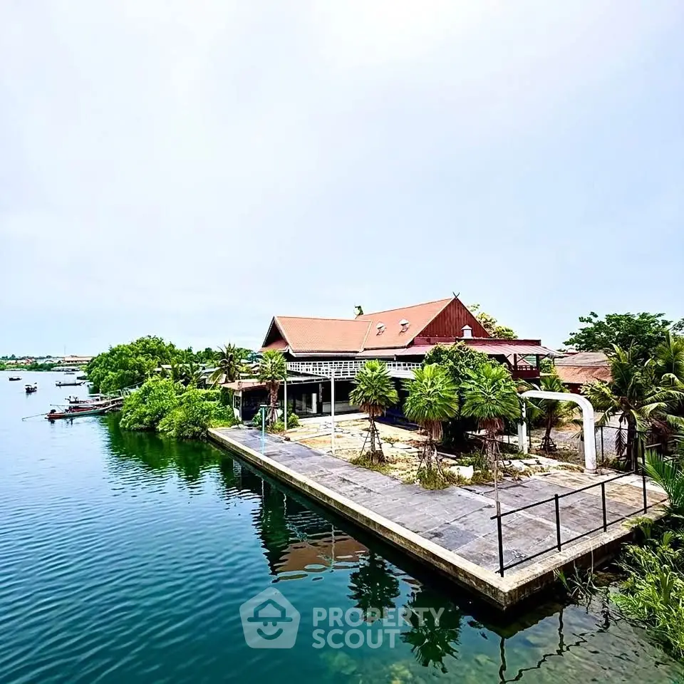 Stunning waterfront property with lush greenery and serene views, perfect for luxury living or investment.