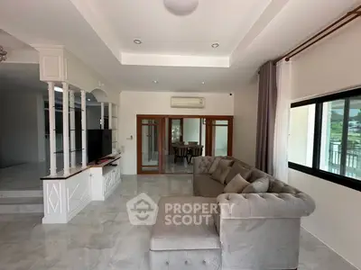 Spacious living room with elegant sofa and modern decor