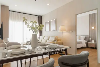 Modern open-plan living and dining area with elegant decor and natural light