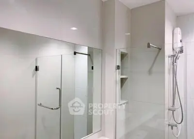 Modern bathroom with glass shower and sleek fixtures