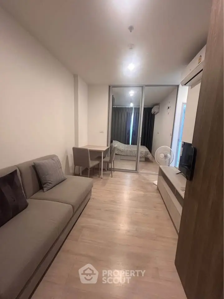 Modern living room with cozy sofa and dining area in a stylish apartment