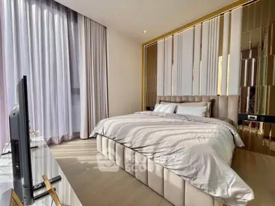 Luxurious bedroom with elegant decor and floor-to-ceiling curtains