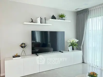 Modern living room with sleek TV setup and elegant decor