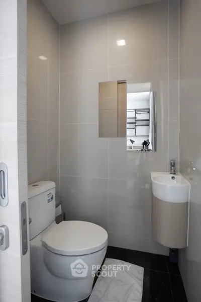 Modern bathroom with sleek design and compact layout