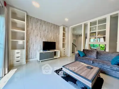 Spacious modern living room with stylish decor and ample natural light