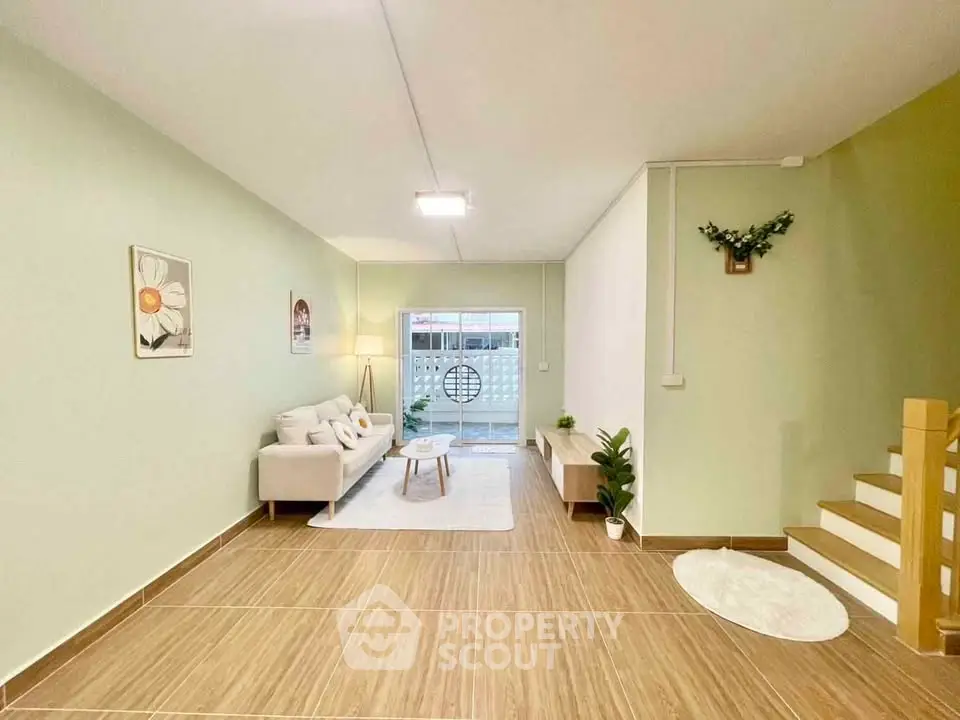 Spacious living room with modern decor and natural light