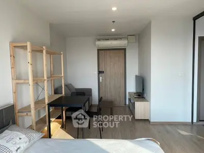 Modern studio apartment with minimalist furniture and natural light