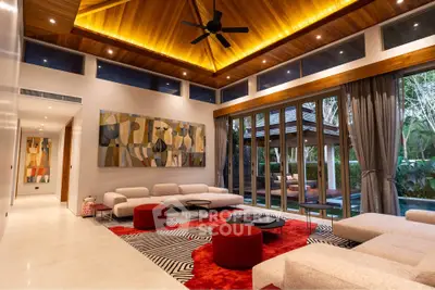 Luxurious modern living room with high ceilings and poolside view