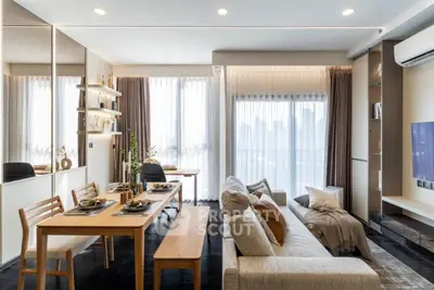 Modern living room with dining area, stylish decor, and city view through large windows.