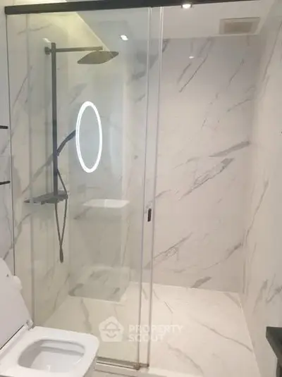 Modern bathroom with sleek shower and elegant marble design