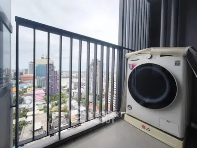 High-rise balcony with city view and modern washing machine.