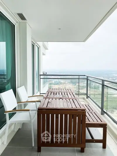 Spacious balcony with modern furniture and stunning city view