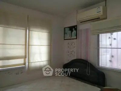 Cozy bedroom with air conditioning and soft lighting, perfect for relaxation.