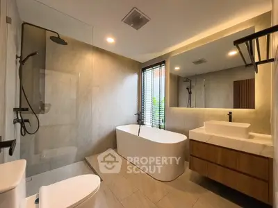Luxurious modern bathroom with freestanding tub and sleek fixtures
