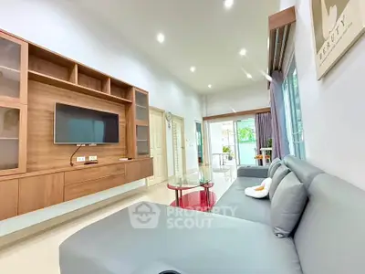 Spacious modern living room with sleek furniture and natural light