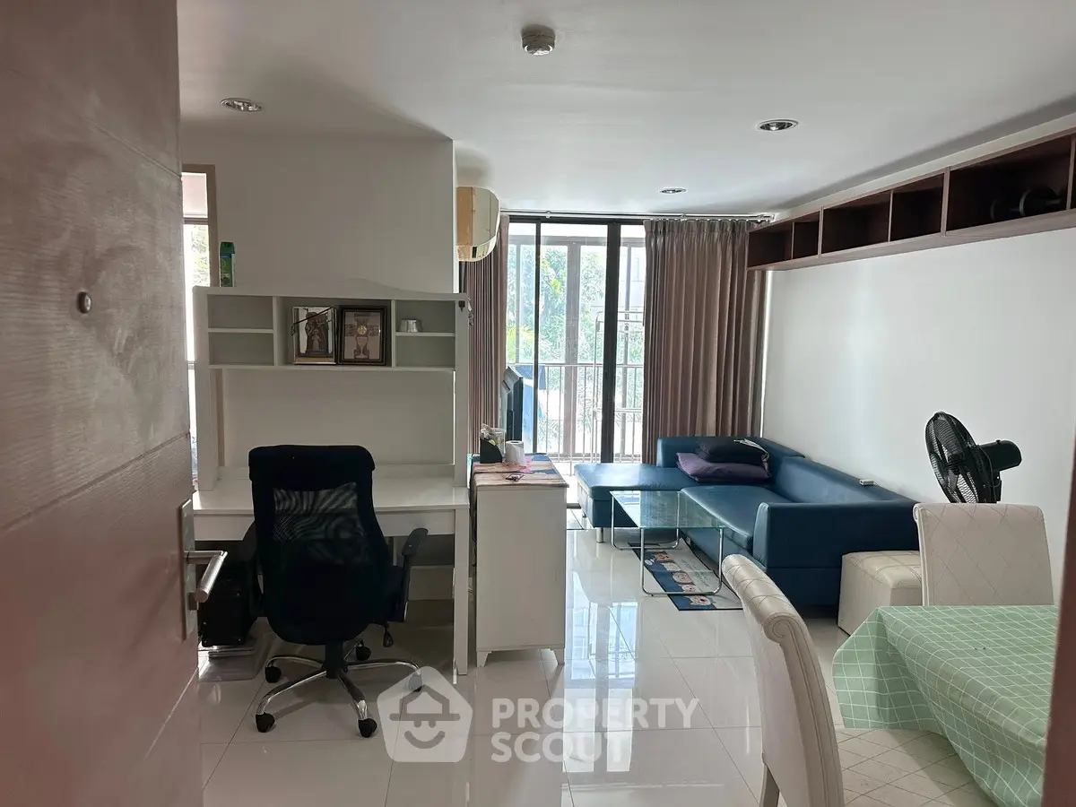 Modern living room with sleek furniture and natural light, perfect for urban living.