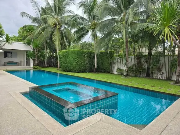 Luxurious private pool with lush tropical garden and modern design