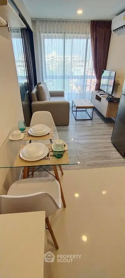 Modern living room with dining area and large window view
