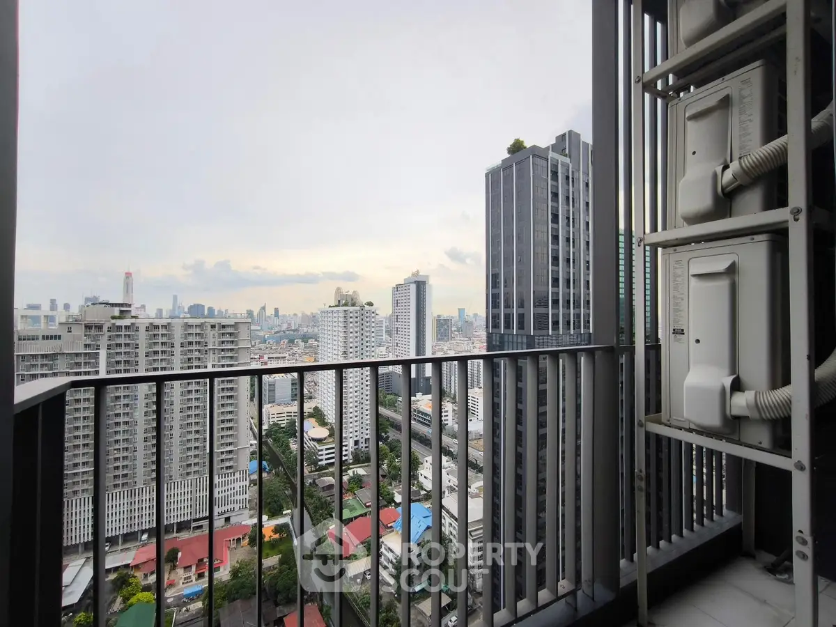 Stunning cityscape view from high-rise balcony with modern urban skyline.