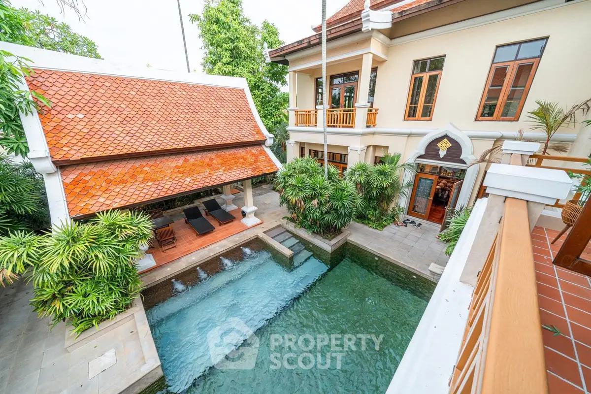 Luxurious villa with private pool and lush greenery, perfect for serene living.
