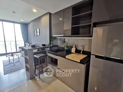 Modern kitchen with sleek cabinetry and open layout in a stylish apartment