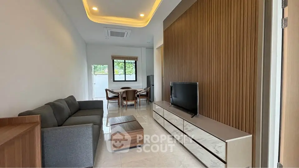 Modern living room with sleek furniture and stylish lighting