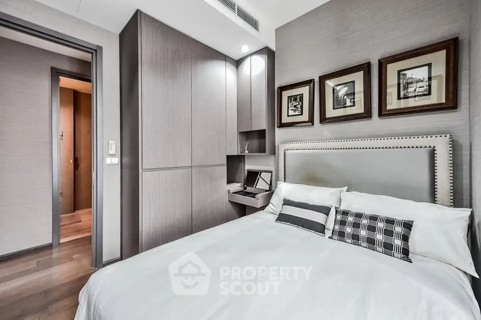 Modern bedroom with stylish decor and cozy ambiance in a luxury apartment.