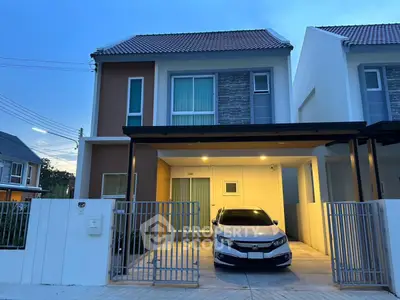 Modern two-story house with carport and sleek exterior design