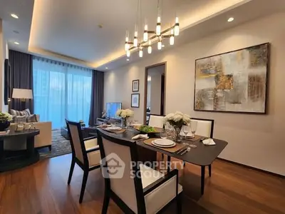 Elegant dining area with modern chandelier and stylish decor in a luxurious apartment.