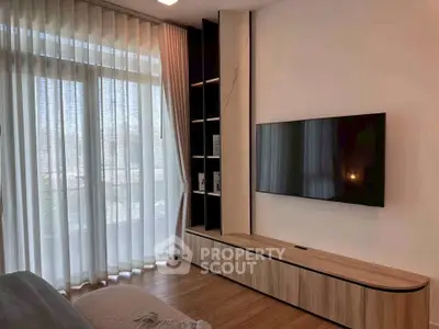 Modern living room with large window and sleek TV unit