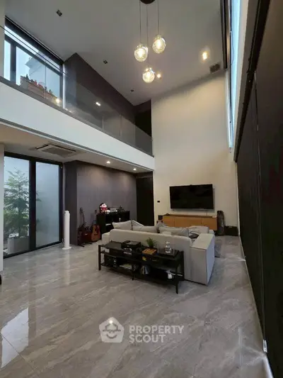 Luxurious modern living room with high ceilings and elegant decor