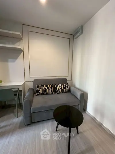 Cozy living room with modern gray sofa and stylish decor